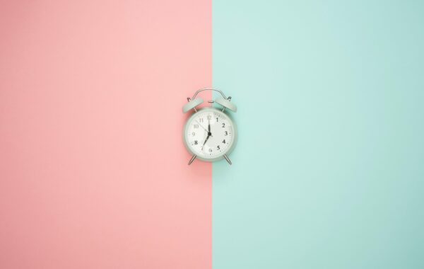 Clock with split background colour blue and pink